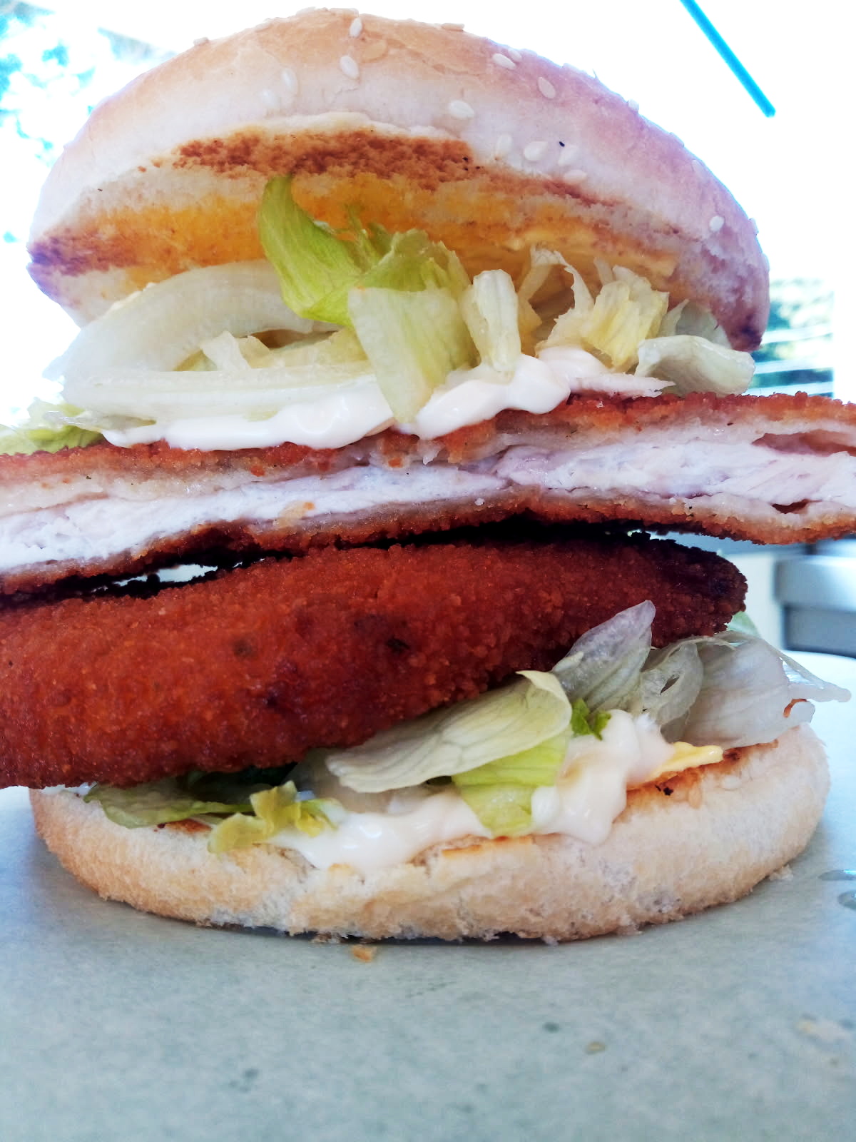 Chicken schnitzel burger with lettuce and mayo
