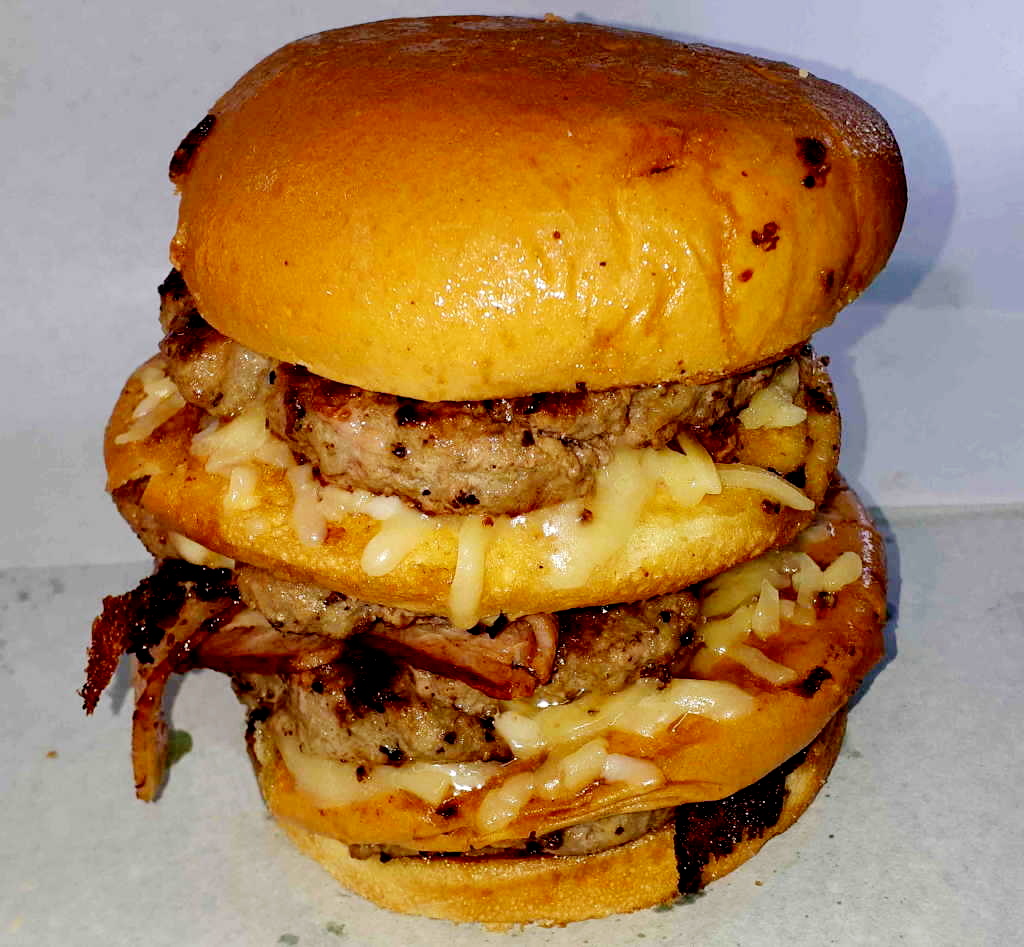 Tower burger stacked with beef patties and cheese