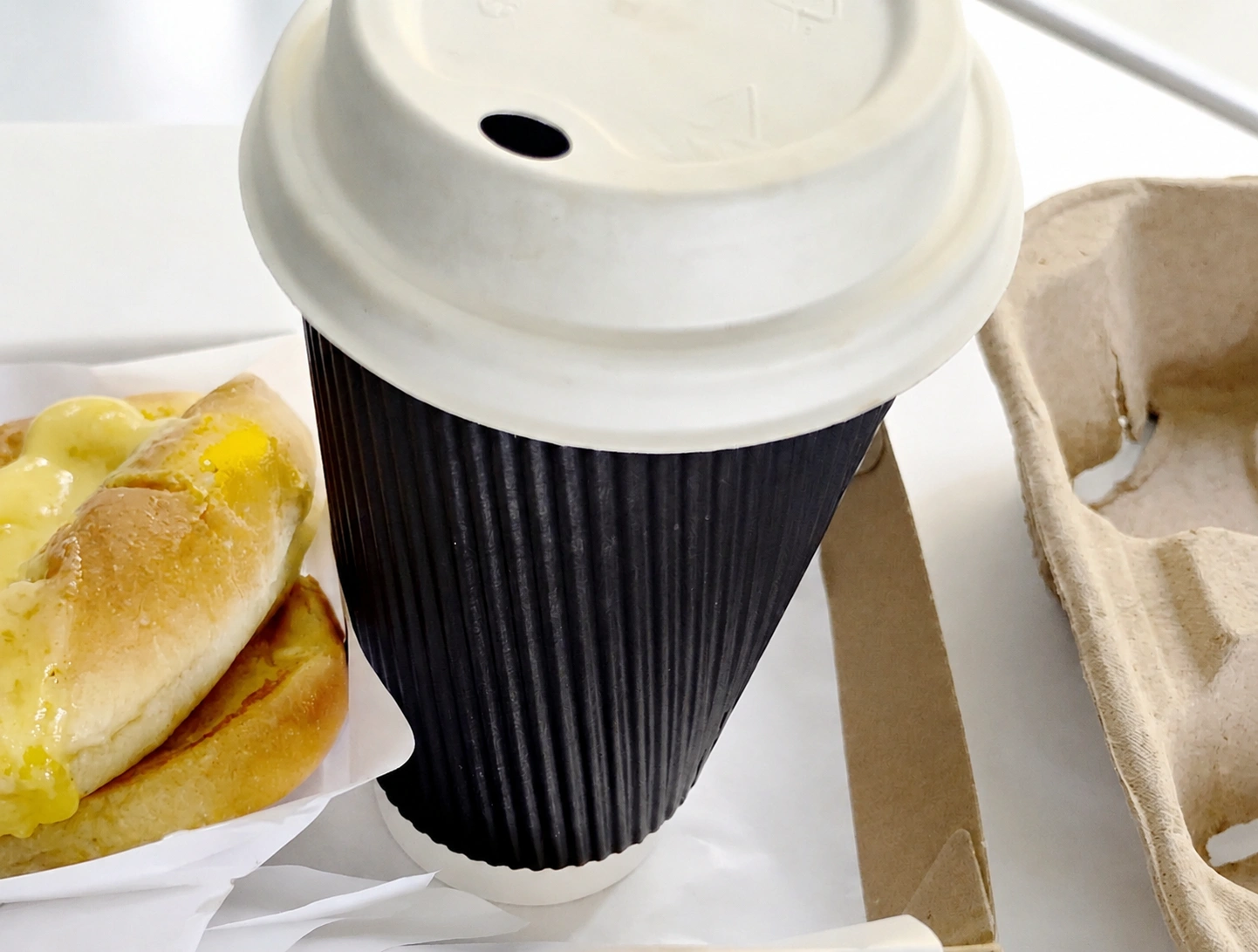Takeaway coffee cup with breaky bun